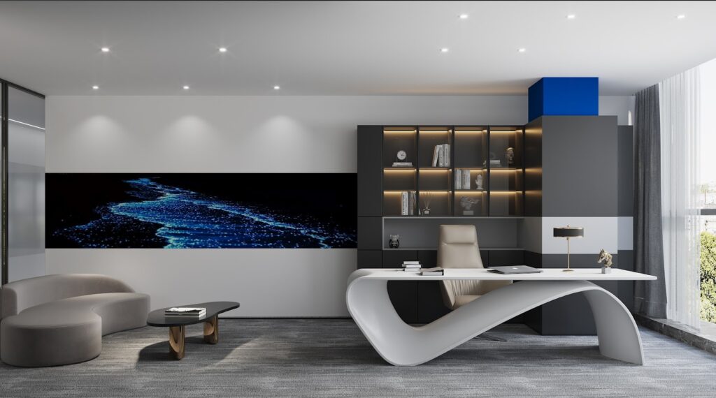 Modern home office with white desk, beige sofa, grey cabinets and large wall art with waves.